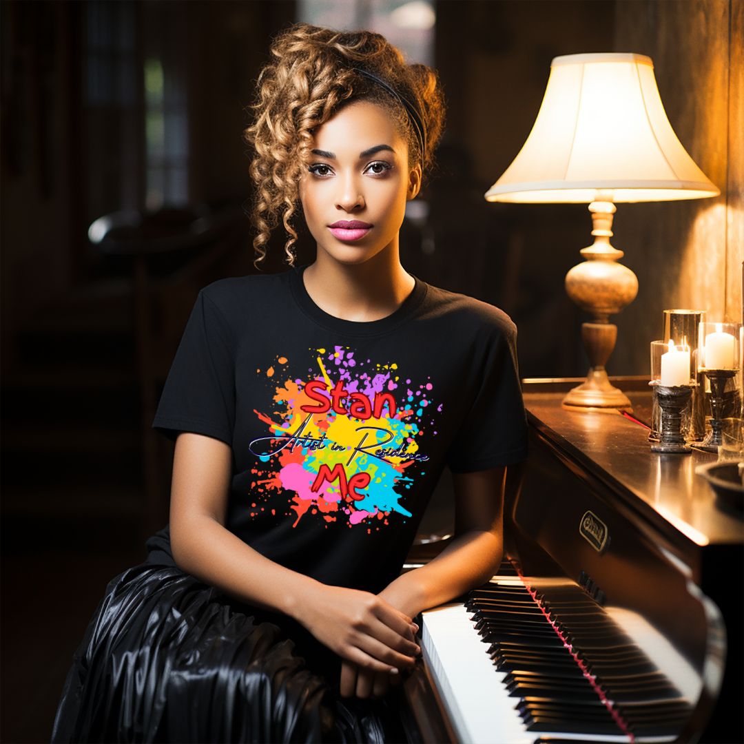 “Stan Me, Artist in Residence” tees featuring paint splatter designs, blending artistic creativity with stan culture. Available in 8 unique styles. Perfect for artists looking to attract fans and gigs.