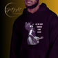 A stylish black and white Heavyweight Be the Light Unisex Hoodie displayed against a backdrop of creativity. The bold graphics symbolize authenticity, inviting artists to embrace their vision and be the light for their audience. - Color Black