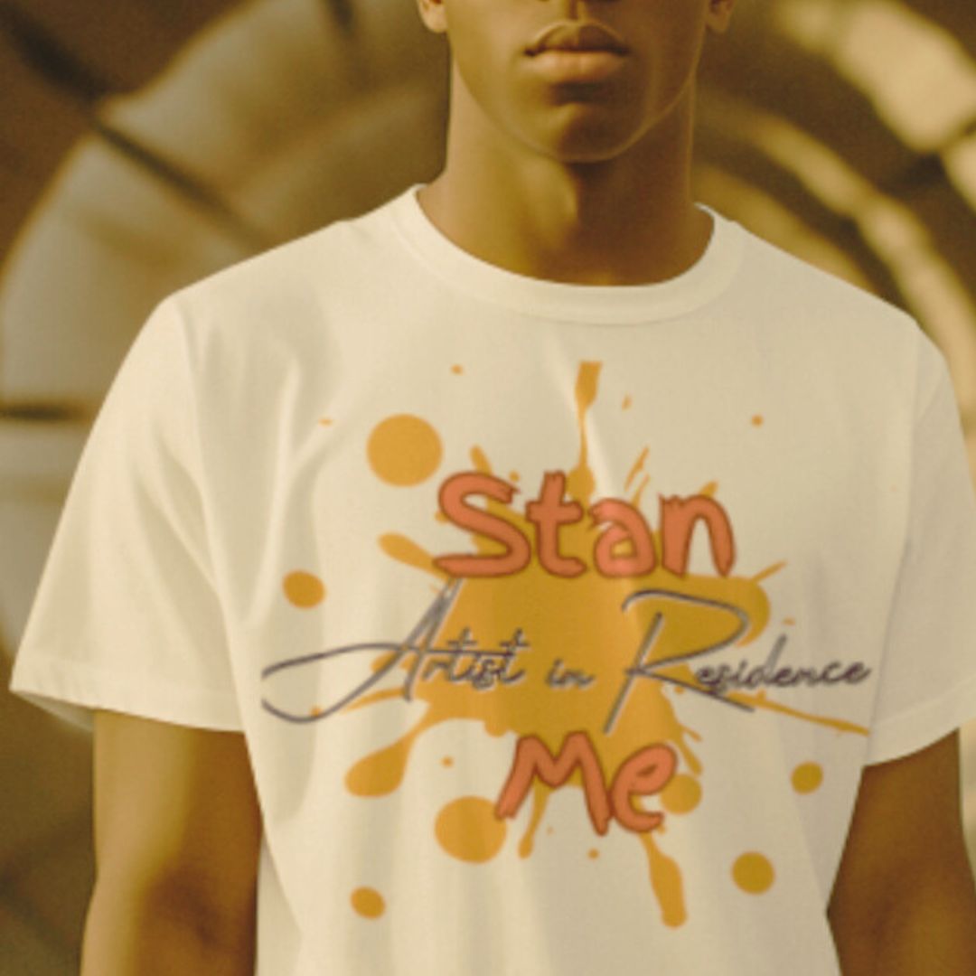 “Stan Me, Artist in Residence” tees featuring paint splatter designs, blending artistic creativity with stan culture. Available in 8 unique styles. Perfect for artists looking to attract fans and gigs.