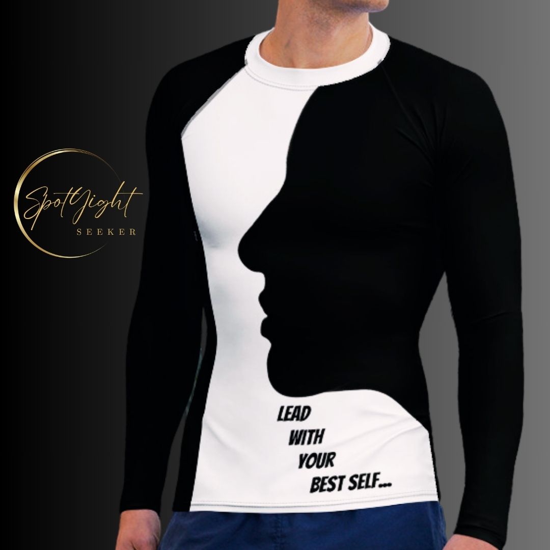 A confident man wearing the LBS Motivate Merch Men's Rash Guard, ready to lead with his best self and set goals for success