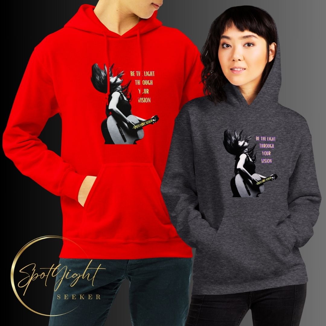 A stylish black and white Heavyweight Be the Light Unisex Hoodie displayed against a backdrop of creativity. The bold graphics symbolize authenticity, inviting artists to embrace their vision and be the light for their audience.