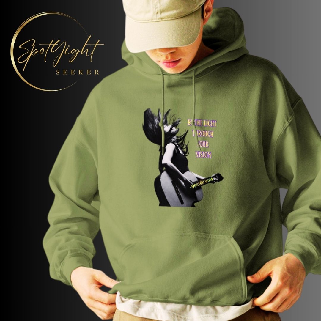 A stylish black and white Heavyweight Be the Light Unisex Hoodie displayed against a backdrop of creativity. The bold graphics symbolize authenticity, inviting artists to embrace their vision and be the light for their audience.