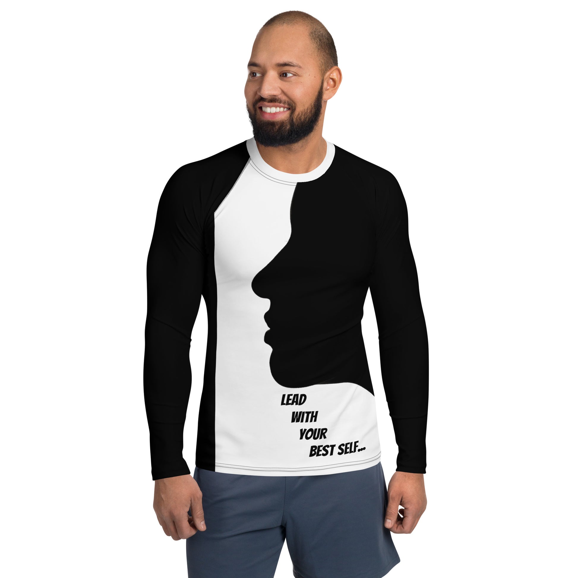 A confident man wearing the LBS Motivate Merch Men's Rash Guard, ready to lead with his best self and set goals for success