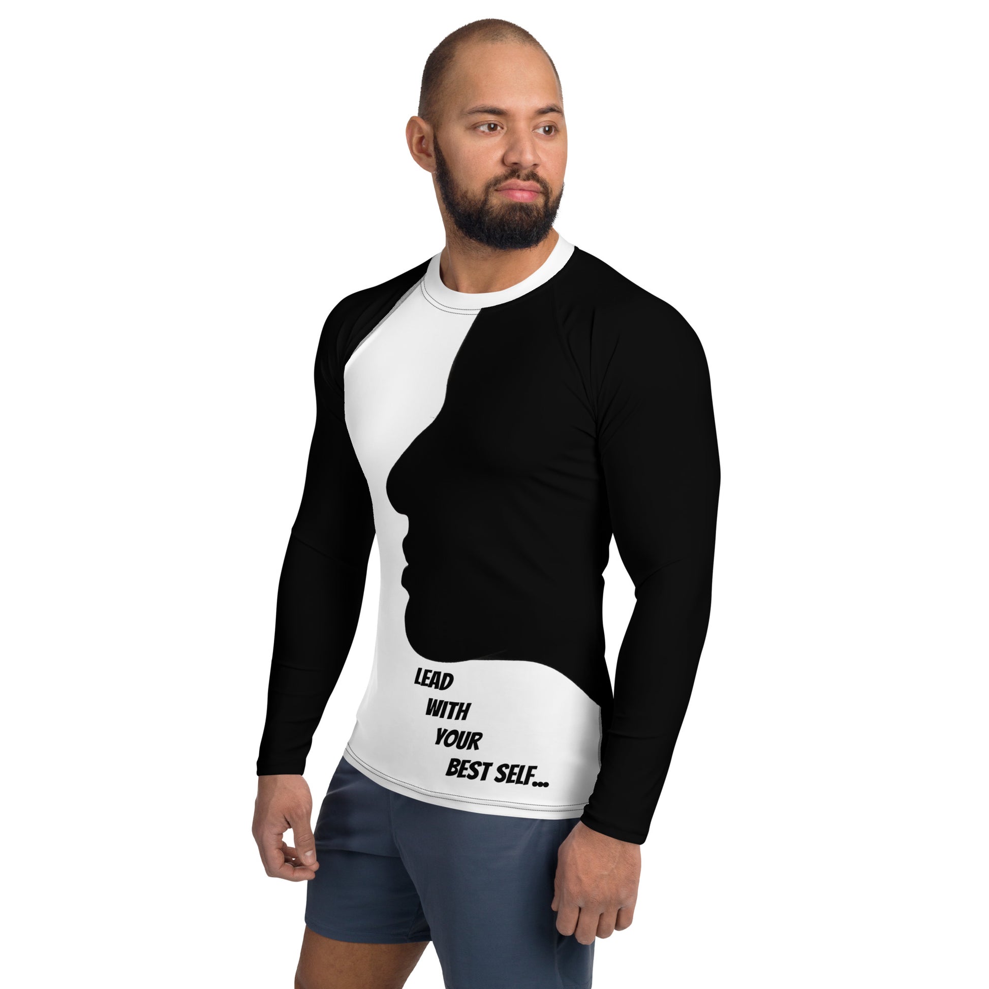 A confident man wearing the LBS Motivate Merch Men's Rash Guard, ready to lead with his best self and set goals for success