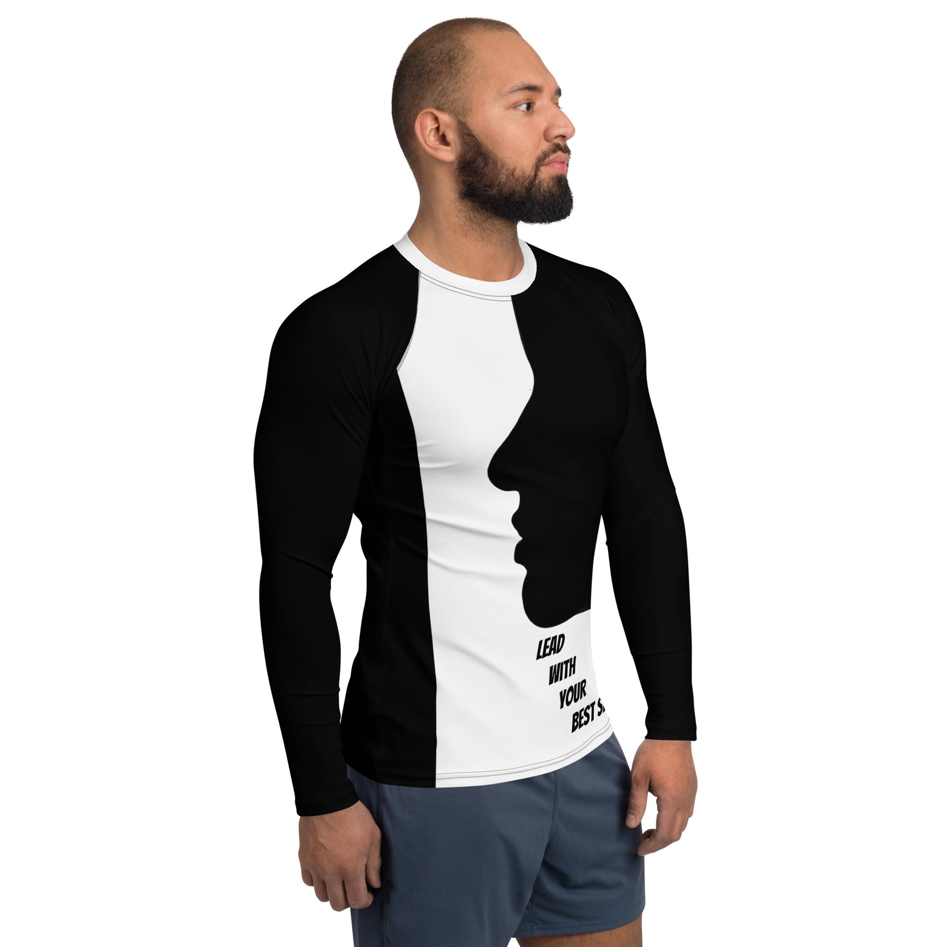 A confident man wearing the LBS Motivate Merch Men's Rash Guard, ready to lead with his best self and set goals for success