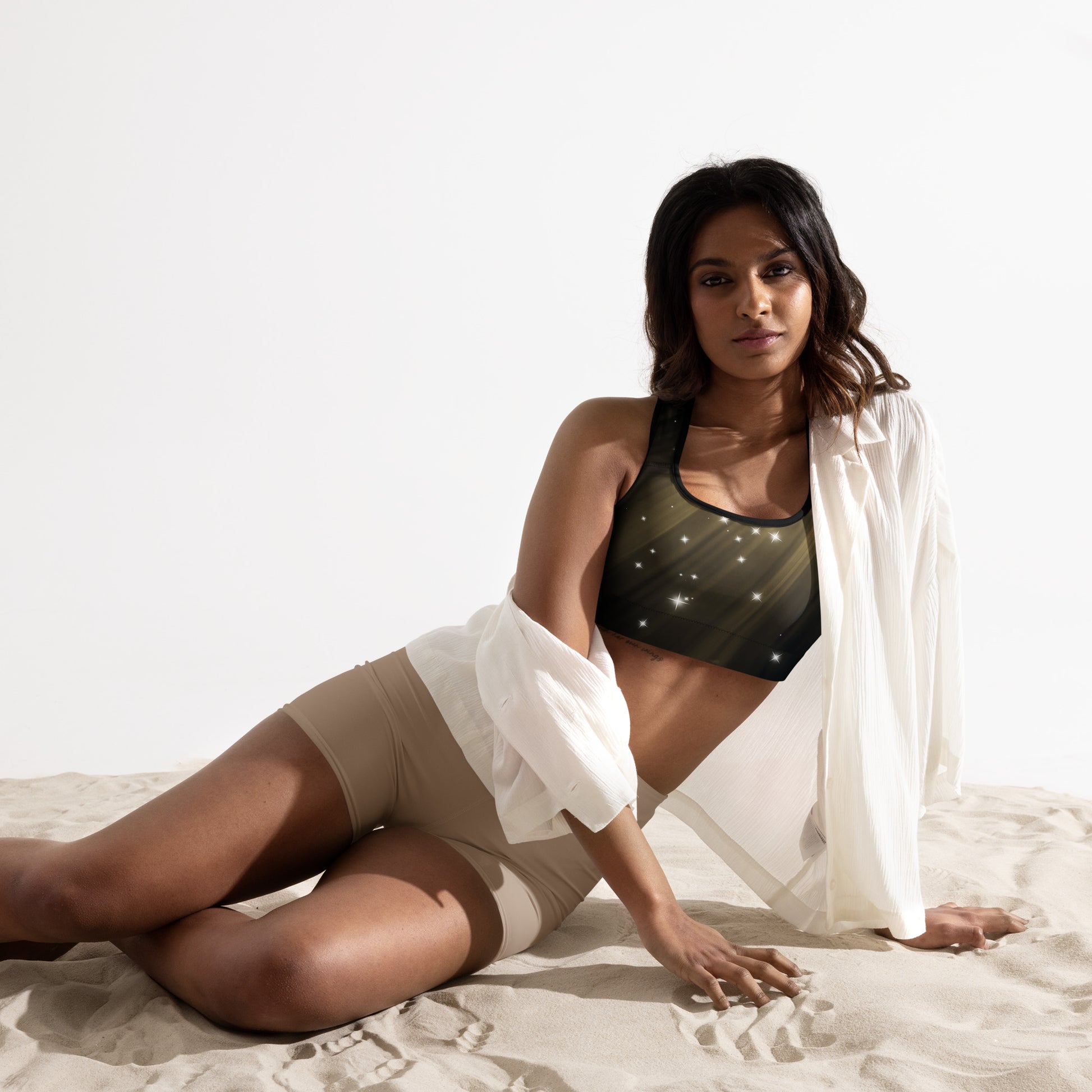 Female artist shine bright rocking your Gold Spotlyght Padded Sports Bra