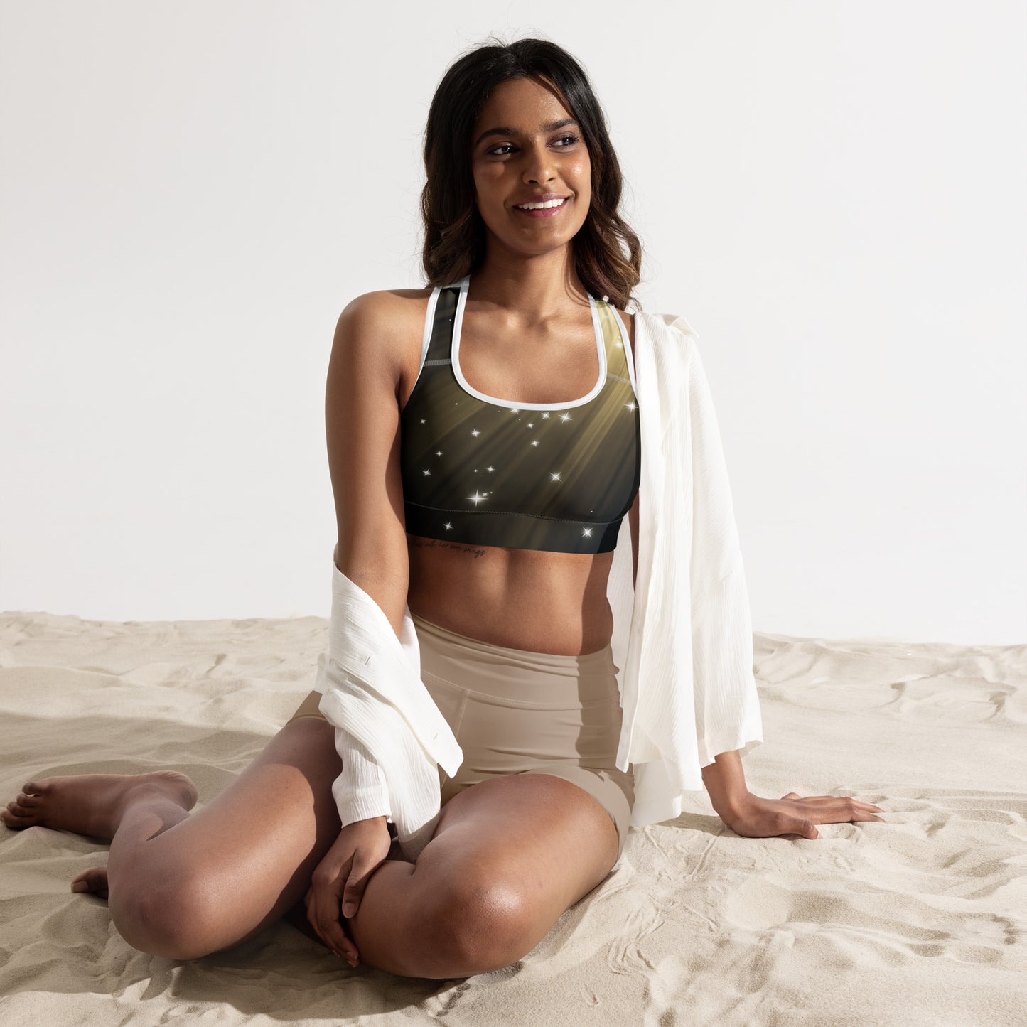 Female artist shine bright rocking your Gold Spotlyght Padded Sports Bra