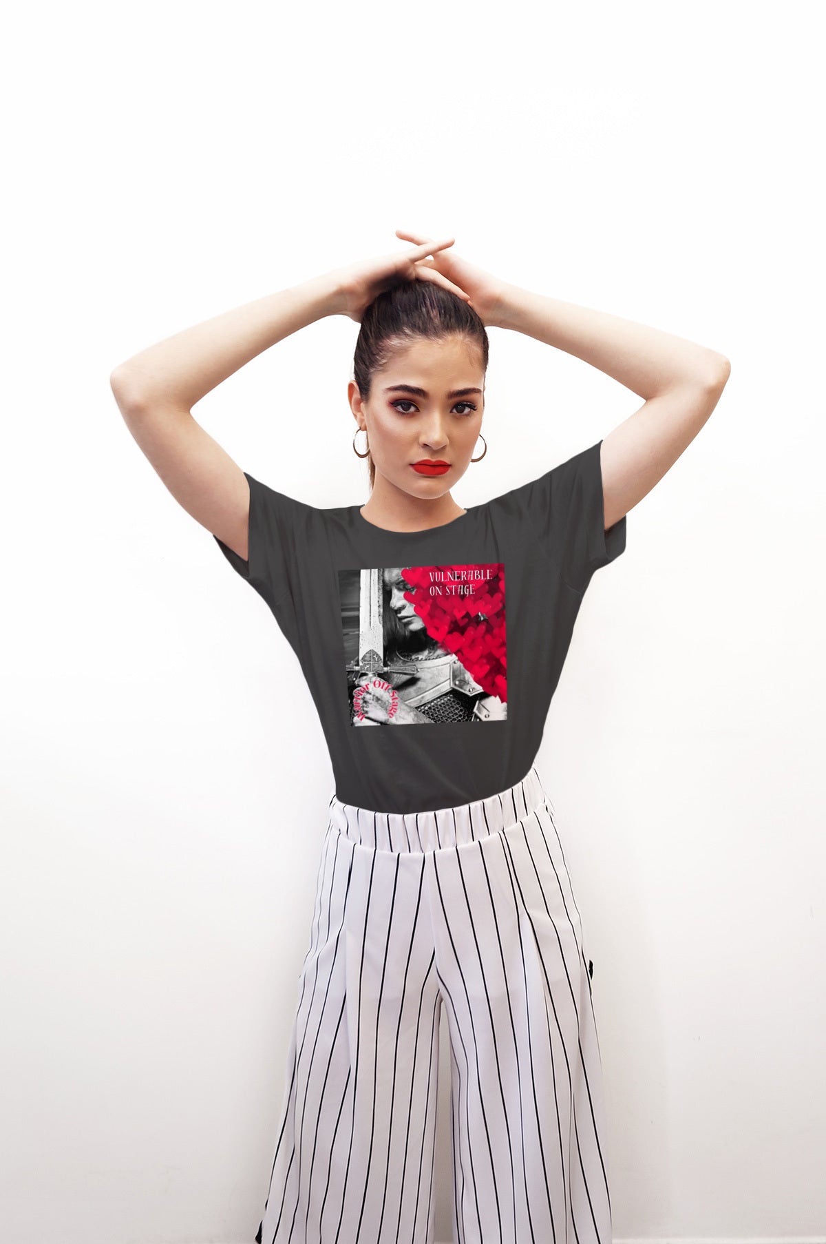 A bold and stylish Unisex Artist Vulnerable Warrior T-Shirt in Classic design, specifically crafted for Female Artists The shirt features empowering graphics, celebrating authenticity on stage and fierce warrior strength off stage. Perfect for making a statement in the world of art and beyond. Dark Heather Grey.