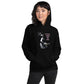 A stylish black and white Heavyweight Be the Light Unisex Hoodie displayed against a backdrop of creativity. The bold graphics symbolize authenticity, inviting artists to embrace their vision and be the light for their audience.