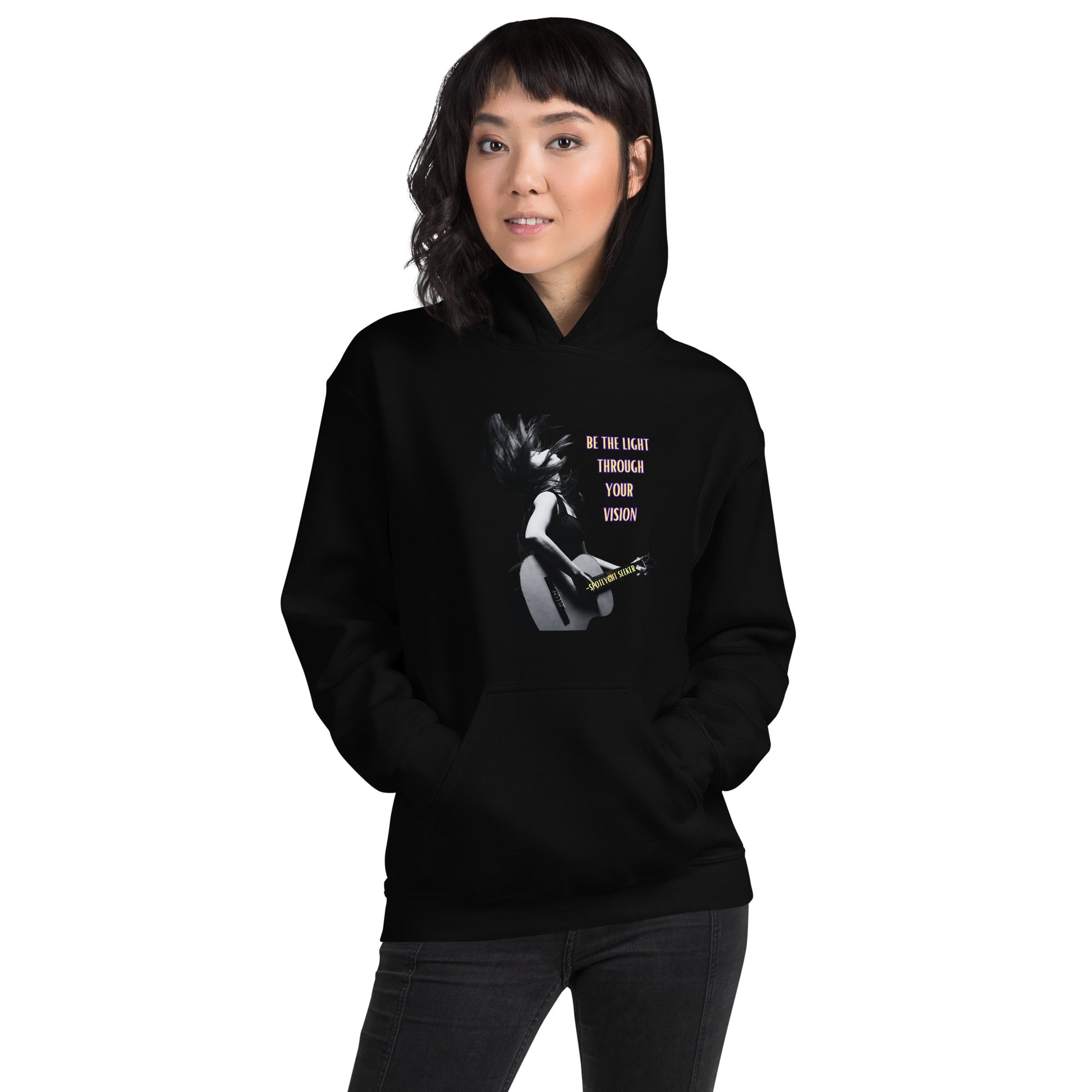 A stylish black and white Heavyweight Be the Light Unisex Hoodie displayed against a backdrop of creativity. The bold graphics symbolize authenticity, inviting artists to embrace their vision and be the light for their audience.