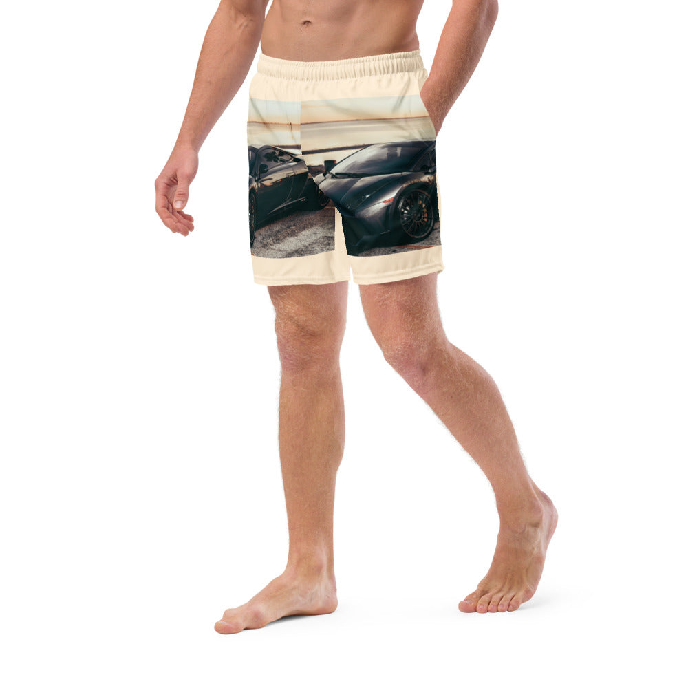 Male artist confidently stands out in vibrant race car swim trunks from SpotlYght Seeker, symbolizing success and creative expression. Skrrt your way to style and savings!